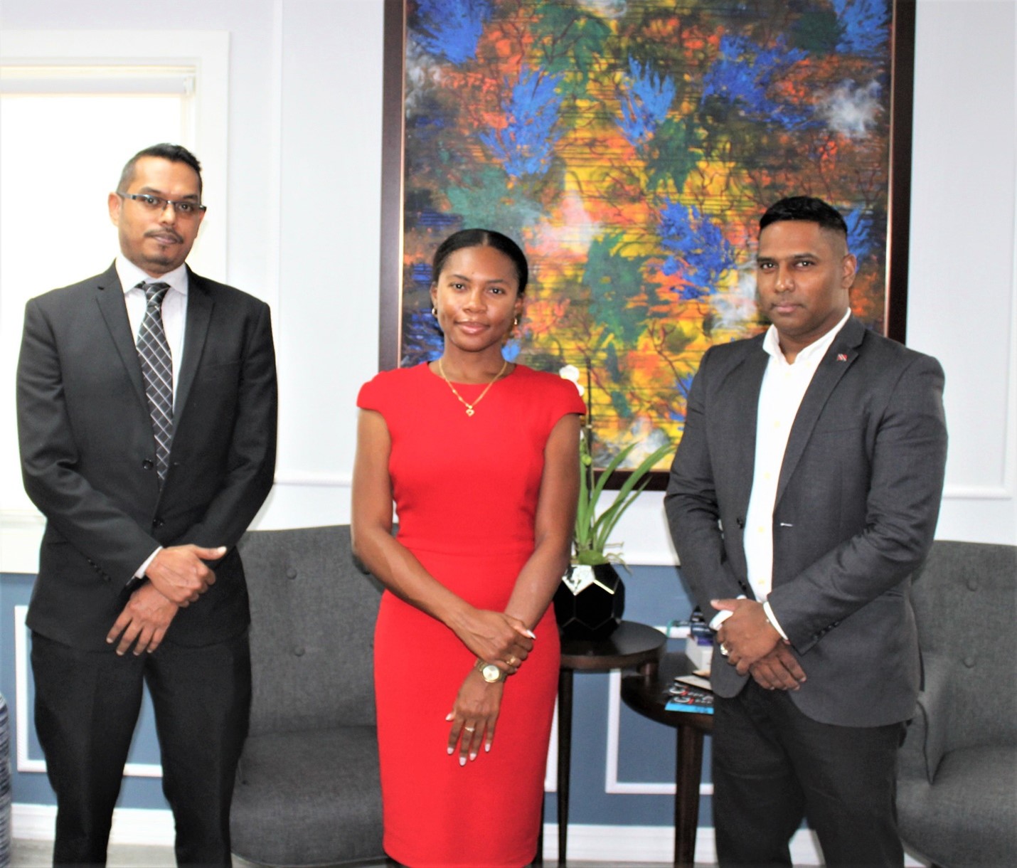Chief Personnel Officer, Commander Dr. Daryl Dindial (right) flanked by Ms. Christianne Hope (center) and Mr. Seeraj Gajadhar o